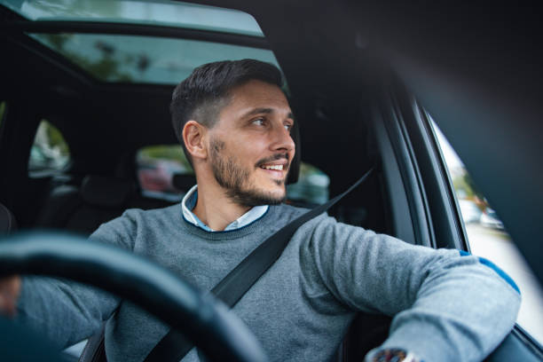 A driver behind the wheel during a calm morning commute, illustrating everyday auto coverage in action